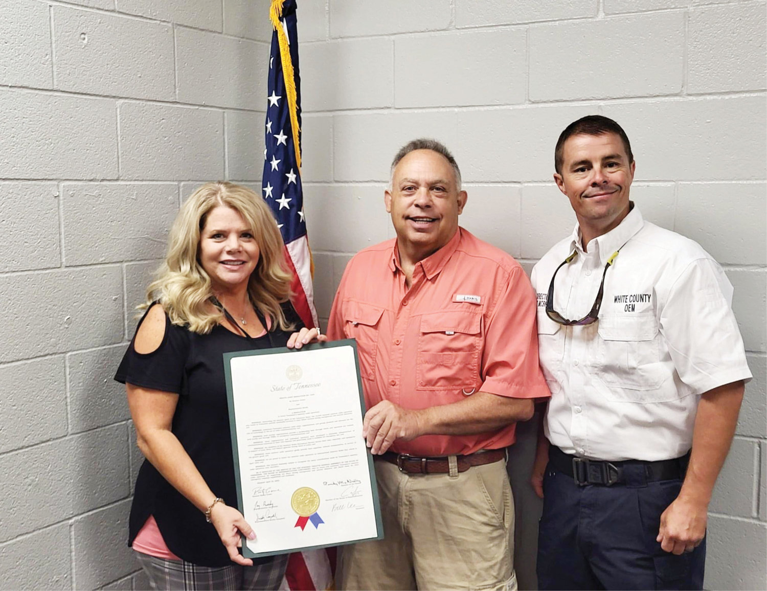 L-R: White County E-911 director Suzi Haston and White County Office of Emergency Management director Matt McBride (far right) present a proclamation to Mike Henry (center), a member of  White County Amateur Radio Club.